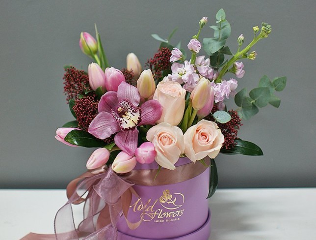Box with tulips and orchids photo
